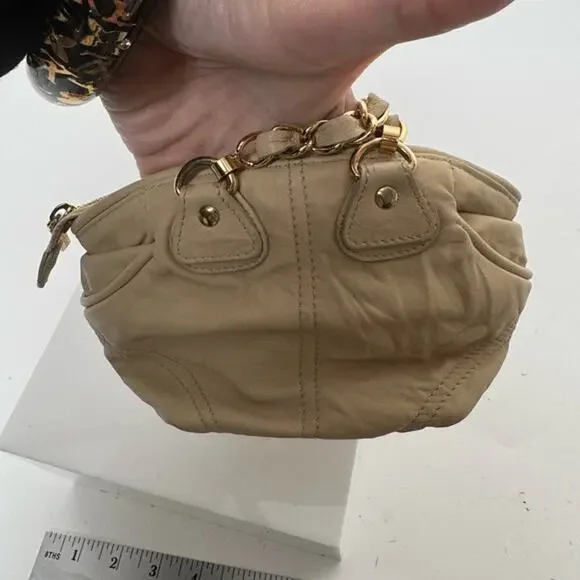 Dolce and Gabbana miniature leather bag with kiss lock, plaque and gold hardware